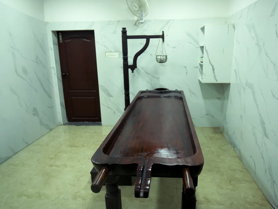 Traditional Ayurvedic treatment room at the Coimbatore clinic