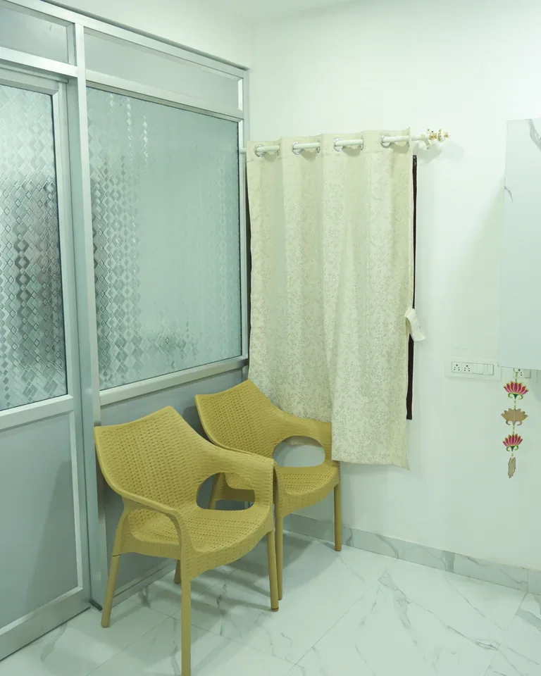 Interior clinic space with glass partitions and seating