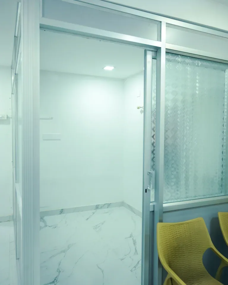 Glass-partitioned room inside Sitaram Ayurveda clinic
