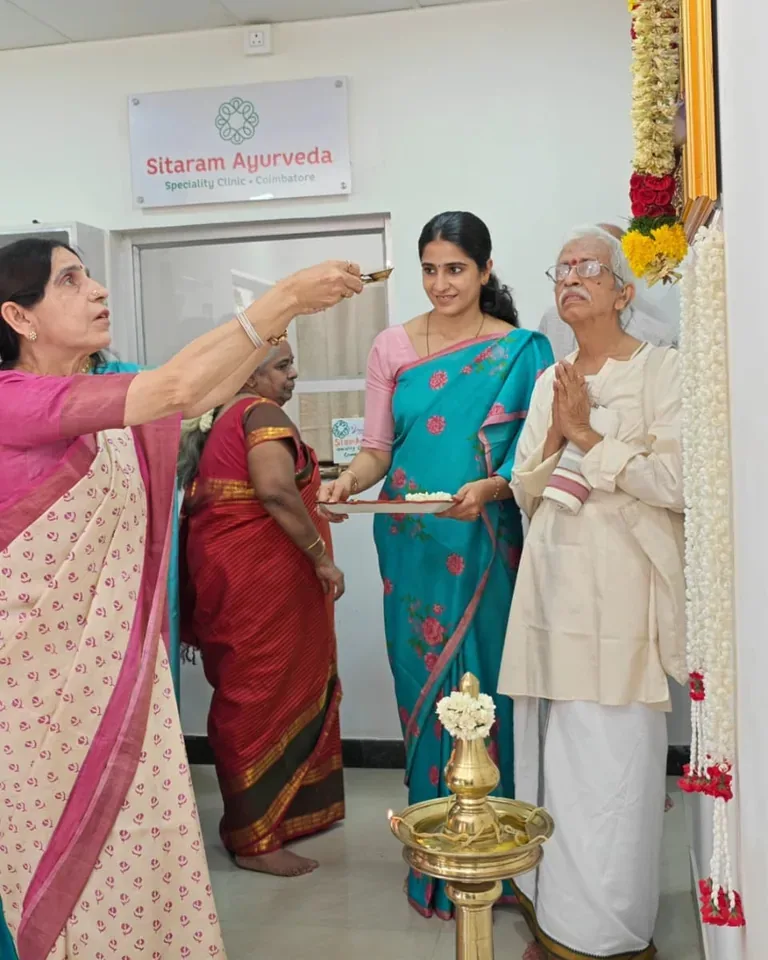 Guests gathered beside the ceremonial lamp during the clinic inauguration
